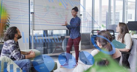 Diverse Team Analyzing Financial Charts in Office Setting