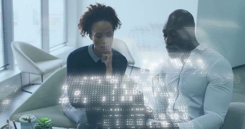 Analyzing Data Together with Digital Binary Overlay in Modern Office Lounge