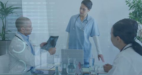 Medical Team Discussing X-Ray with Innovative Data Overlay - Download Free Stock Images Pikwizard.com