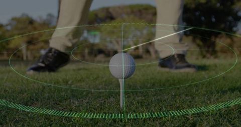 Golf ball on tee receiving augmented reality targeting overlay with crosshair rings