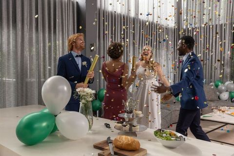 Elegant Celebration with Confetti and Joyful Friends in Reception Hall