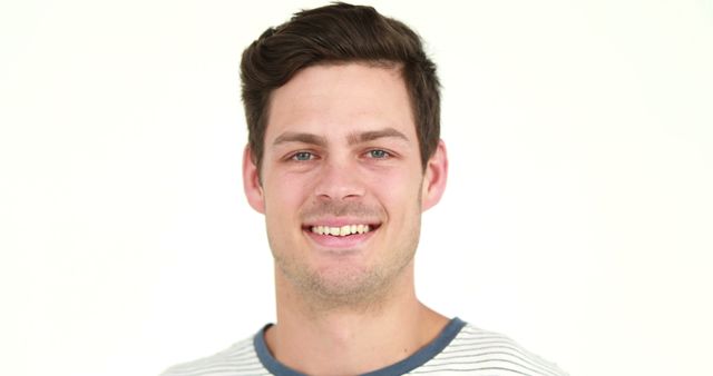 Young Man Smiling with Casual Outfit Against White Background - Download Free Stock Images Pikwizard.com