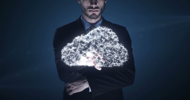 Businessman interacting with glowing holographic cloud - Download Free Stock Images Pikwizard.com