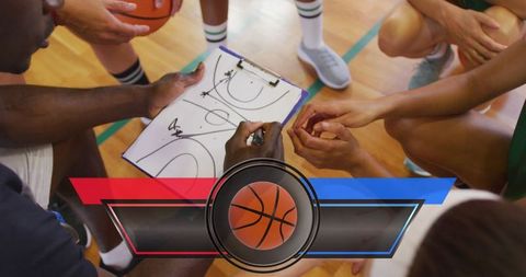 Team strategy session with basketball tactics displayed