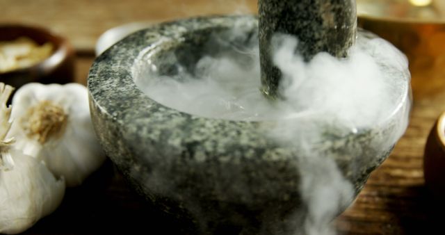 Mystical Mortar and Pestle Creating Smoke with Garlic Cloves on Table - Download Free Stock Images Pikwizard.com