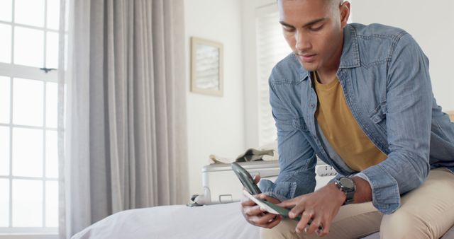 Young Man Packing Suitcase for Travel in Stylish Bedroom - Download Free Stock Images Pikwizard.com