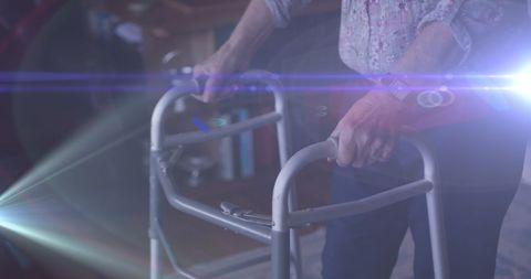 Senior Woman Using Walking Frame with Light Effects