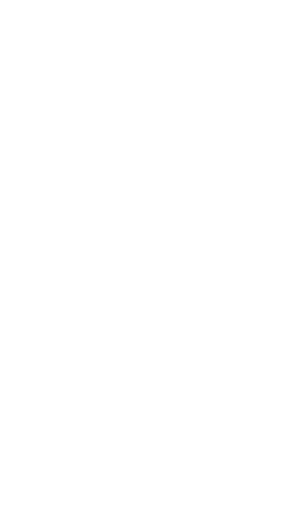 Silhouette of male footballer kicking ball