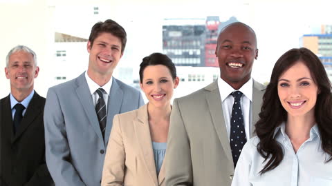 Diverse Business Team Standing Together in Office Setting