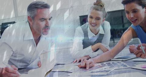 Professionals collaborating with technology overlay