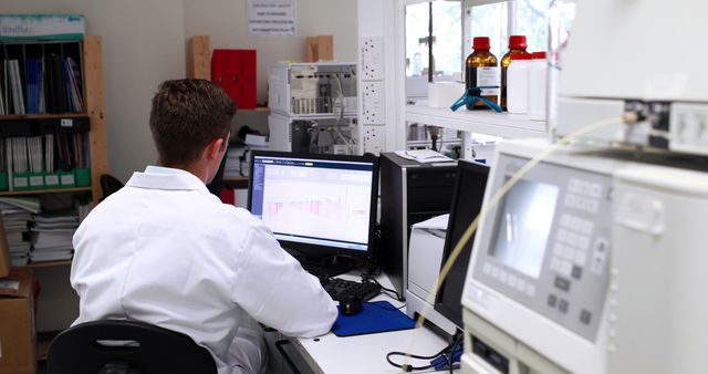 Scientist Analyzing Data on Computer in Laboratory - Download Free Stock Images Pikwizard.com