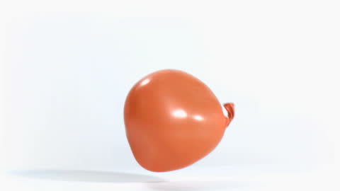 Orange Water Balloon Burst on White Background in Slow Motion