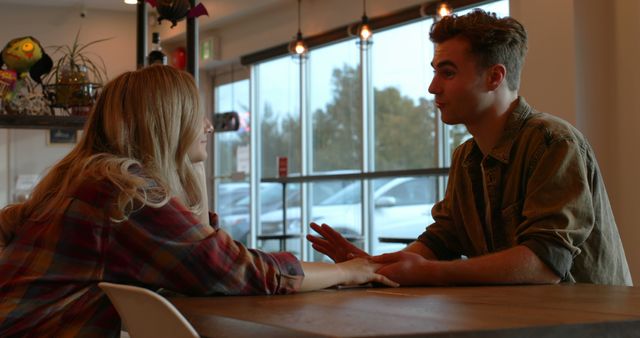 Young couple interacting with each other in cafe. Smiling happy couple 4k