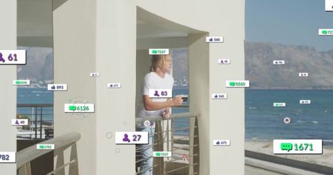 Man Watching Serene Sea from Balcony with Digital Engagement Icons
