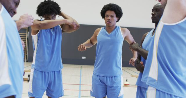 Basketball Team in Blue Jerseys Warming Up Before Game - Download Free Stock Images Pikwizard.com