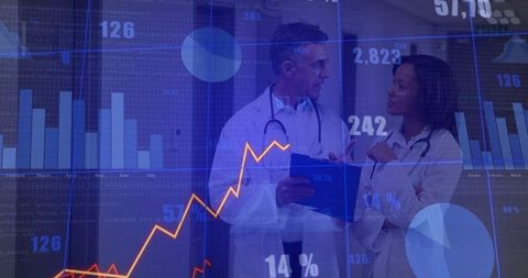 Doctors Collaborating in Hospital with Analytical Charts Overlay