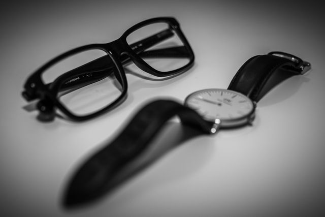 Elegant Black Wristwatch and Reading Glasses on White Background - Download Free Stock Photos Pikwizard.com
