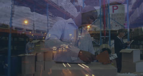 Diverse Workers Managing Warehouse at Night