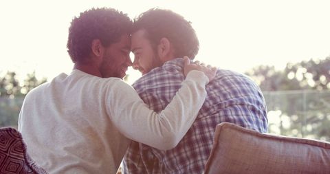 Affectionate couple embracing in warm light
