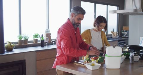 Couple Enjoying Cooking in Modern Kitchen
