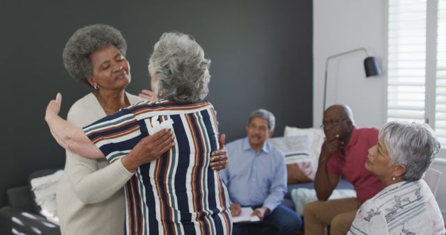 Senior Women Hugging in Therapy Session with Diverse Adults - Download Free Stock Images Pikwizard.com