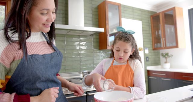 Happy Biracial Mother and Daughter Baking Together in Sunny Kitchen, Bonding and Smiling - Download Free Stock Images Pikwizard.com