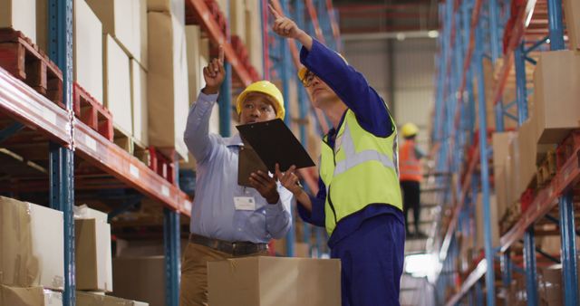 Warehouse Workers Discussing Logistics While Managing Inventory - Download Free Stock Images Pikwizard.com