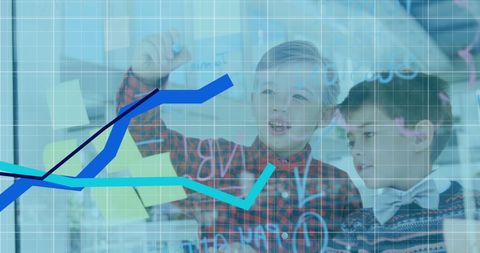 Schoolboys engaging with financial data and graphs in office setting