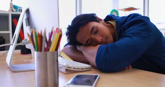 Tired Office Worker Sleeping at Desk with Computer and Smartphone - Download Free Stock Images Pikwizard.com