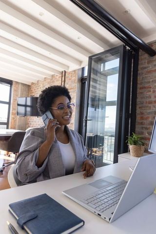 Professional African American Businesswoman at Modern Office Desk