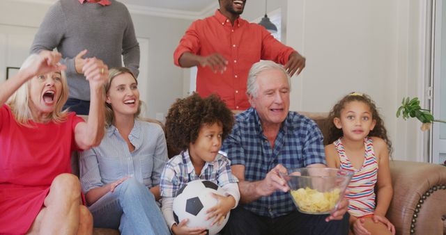 Multigenerational Family Cheering While Watching Sports Game at Home - Download Free Stock Images Pikwizard.com