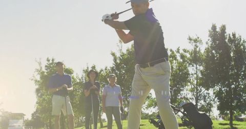 Senior golfers enjoying a sunny day on the golf course