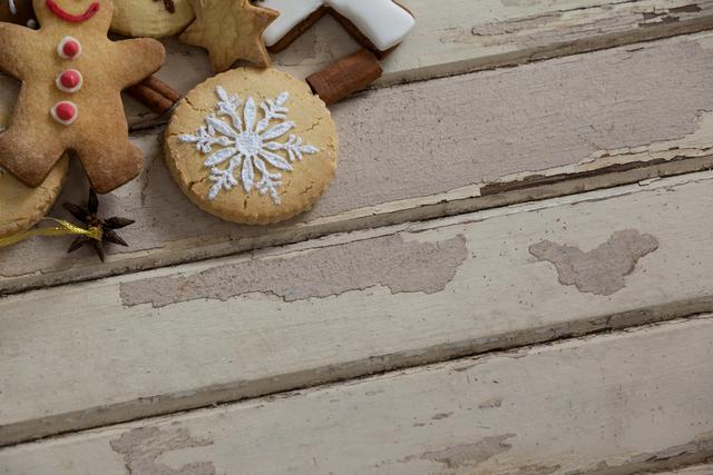 Christmas Cookies and Cinnamon on Rustic Wooden Plank - Download Free Stock Photos Pikwizard.com