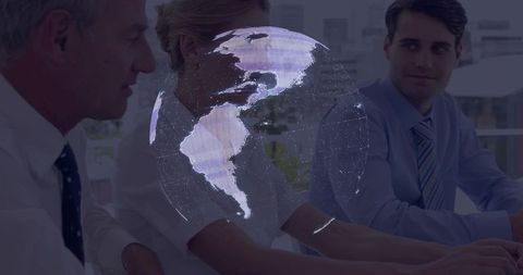 Executives Collaborating with Digital Globe Projection in Modern Office Setting
