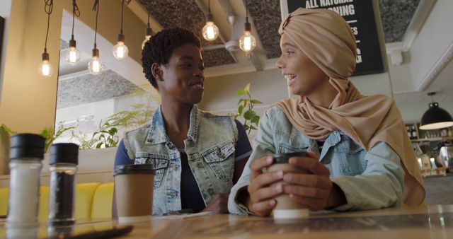 Diverse Friends Enjoying Coffee Together in Modern Café - Download Free Stock Images Pikwizard.com