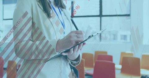 Businesswoman analyzing data charts in modern corporation training room