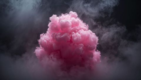 Billowing pink smoke cloud floating above moody gray mist, dramatic studio plume
