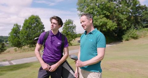 Father and Son Bonding on Golf Course with Clubs