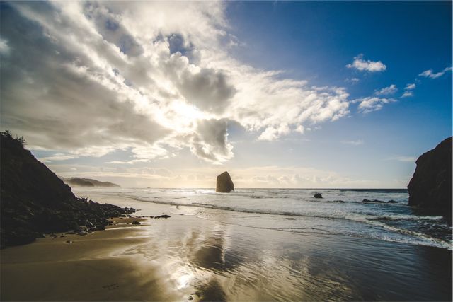 Sunset Beach with Impressive Rock Formation and Dramatic Cloudscape - Download Free Stock Photos Pikwizard.com