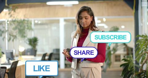 Professional woman checking social media like share subscribe bubbles in modern office