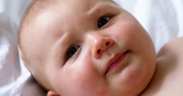 Cute Baby Expressing Curiosity on Bed - Download Free Stock Images Pikwizard.com