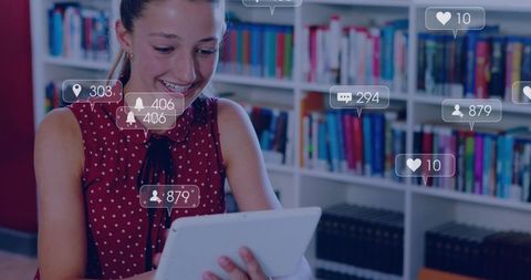 Teen Girl Using Tablet in Library Showing Social Media Notifications Overlay