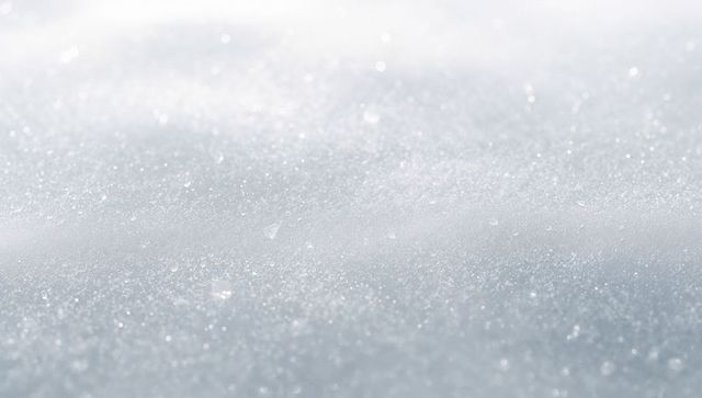 Glittering snow crystal texture with soft bokeh and frosty winter sunlight