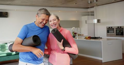 Senior Couple Relaxed After Home Yoga Session, Joyful Companionship