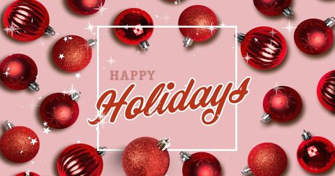 Festive red christmas baubles with happy holidays text