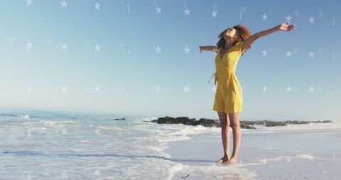 Joyful Woman Enjoying Freedom at Beach with Star Overlay