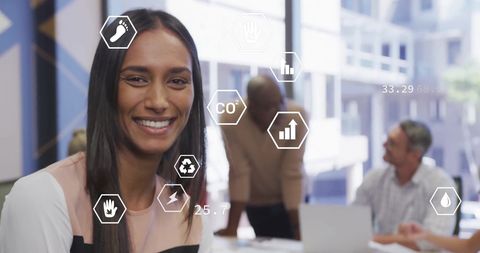 Smiling Professional with Digital Eco-Data Overlay in Modern Office