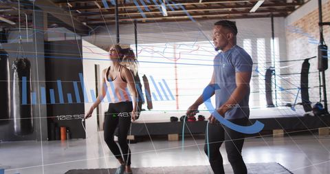 Fitness Enthusiasts Jump Roping with Data Analytics Overlay in Gym - Download Free Stock Images Pikwizard.com