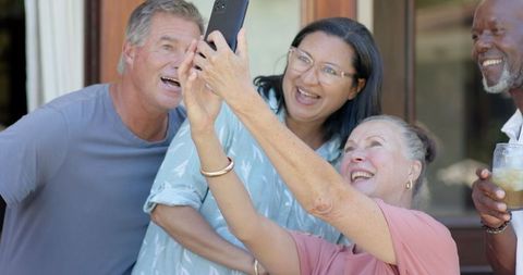 Joyful Diverse Group of Friends Taking Selfie Outdoors