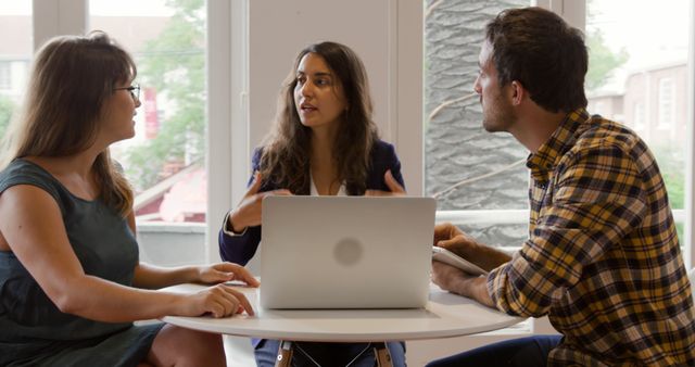 Young Professionals Having Business Meeting Discussion with Laptop - Download Free Stock Images Pikwizard.com